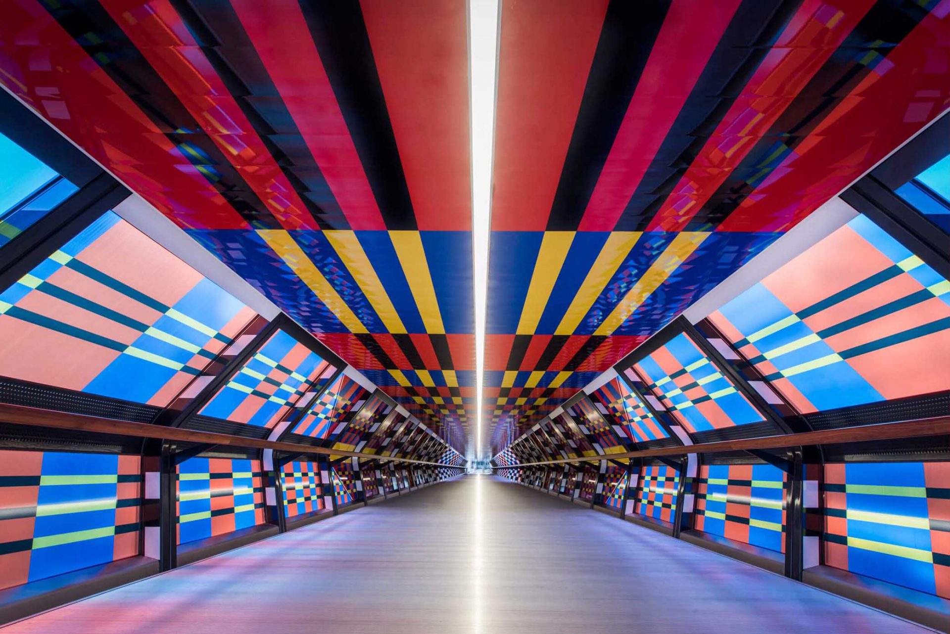 camille walala transforms london's white city place with colorful geometric  patterns
