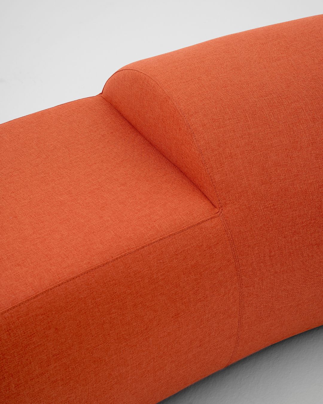 The seating centerpiece's orange hues are symbolic of vitality and warmth. - © Heilig Objects 