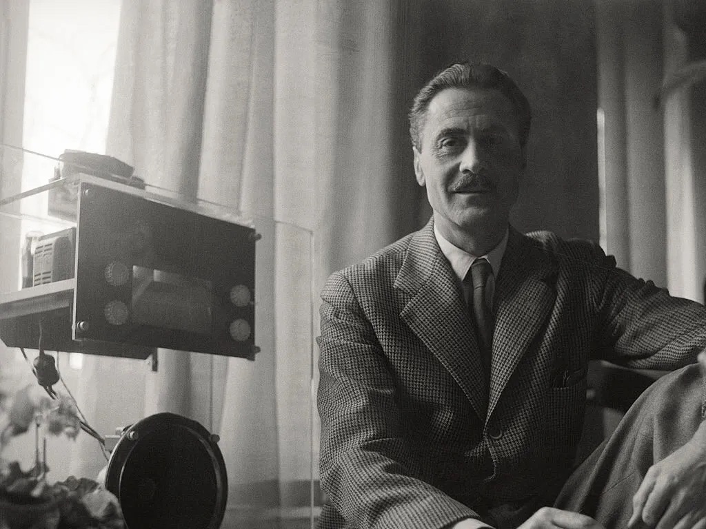 Architect and designer Franco Albini with his transparent radio, designed in 1938